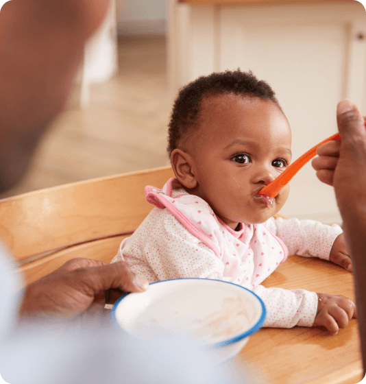 Baby being fed