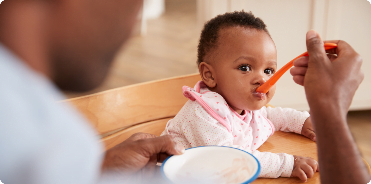 Baby being spoonfed