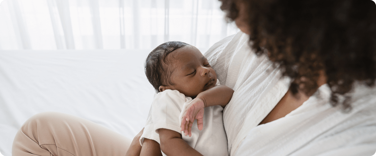 Mother holding a sleeping child