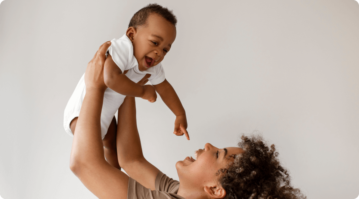 Mother lifting up a child