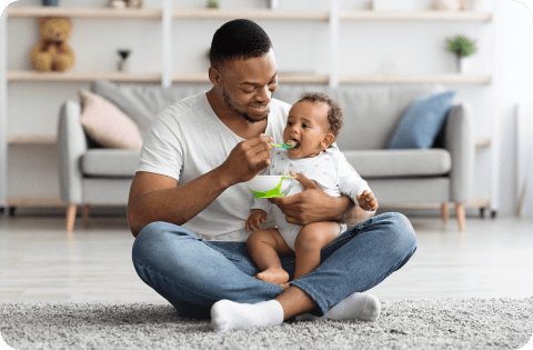 Father feeding baby