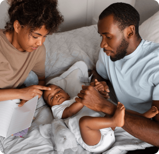 Two parents playing with their child