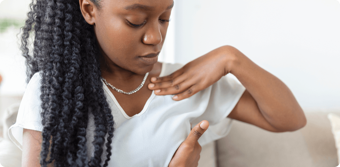 woman examining her breast