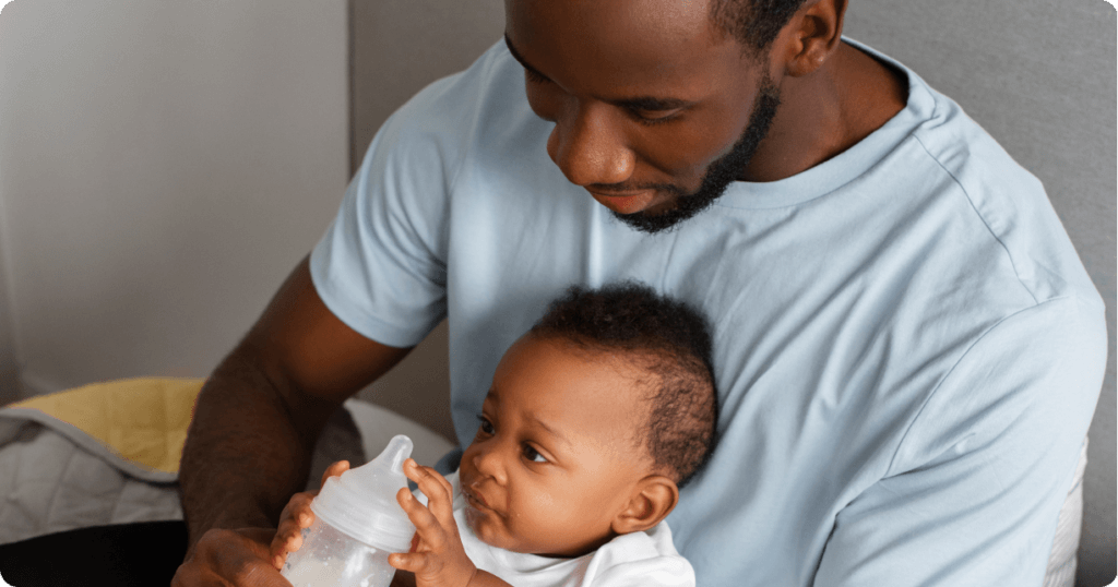 Father feeding a baby